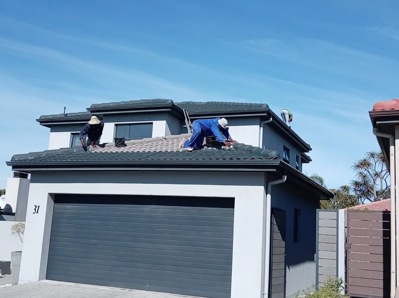 Work in progress exterior and roof painting of a Cape Town home